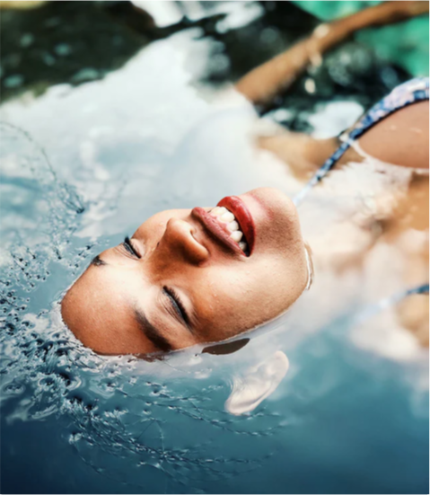 Woman floating in water